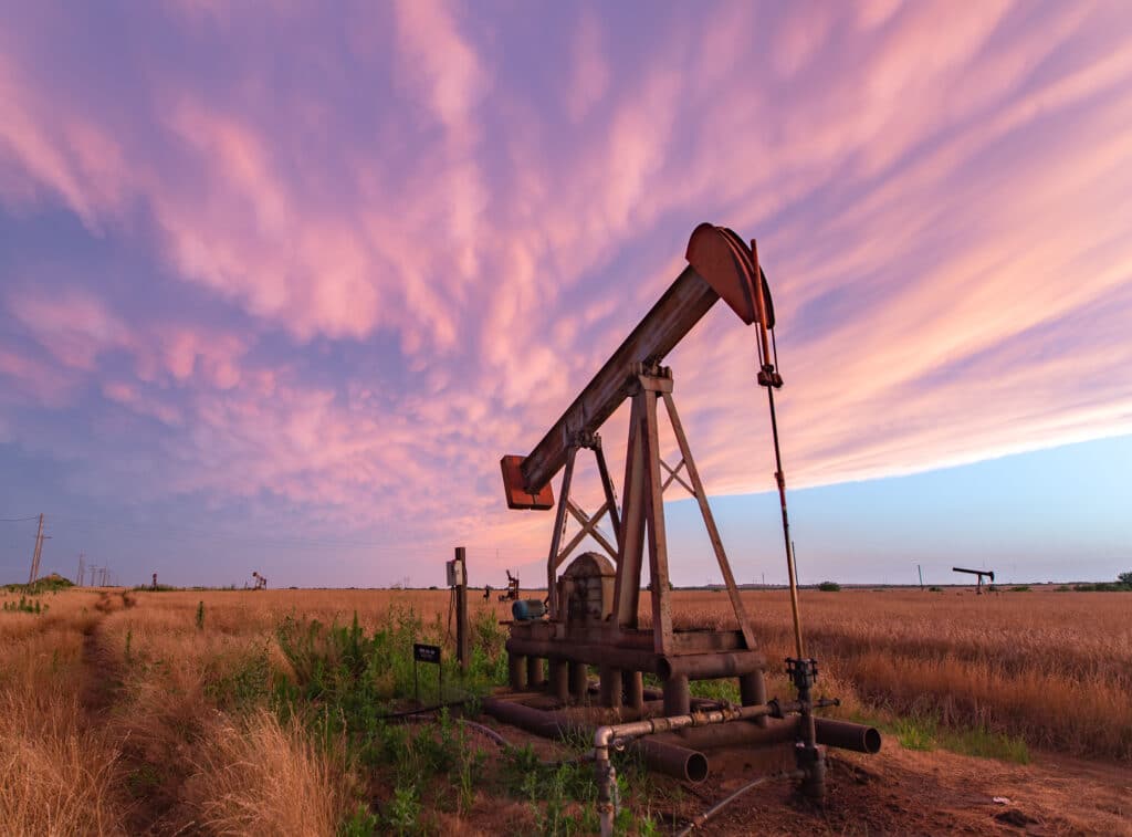 Mammatus clouds behind an oil pumpjack near dusk in Burkburnett, TX back in June